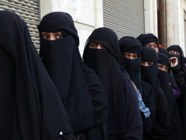 Women In Line In Burka Getty Satya Day