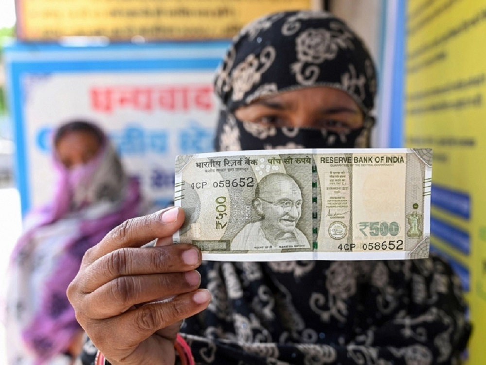 Woman Holding Money