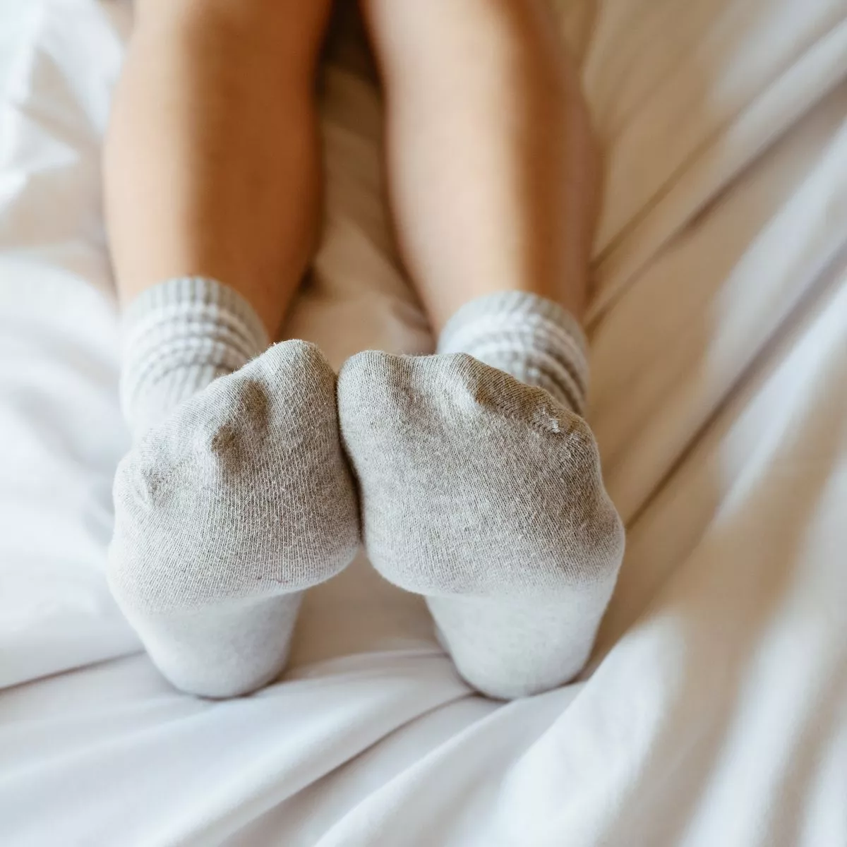 0 Cropped Shot Of Women Relaxing In Bed With Cozy Socks Satya Day