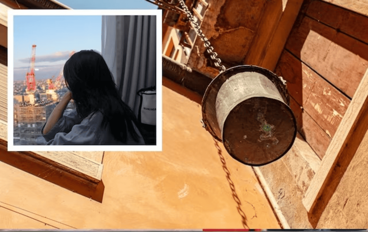Woman hung bucket on window