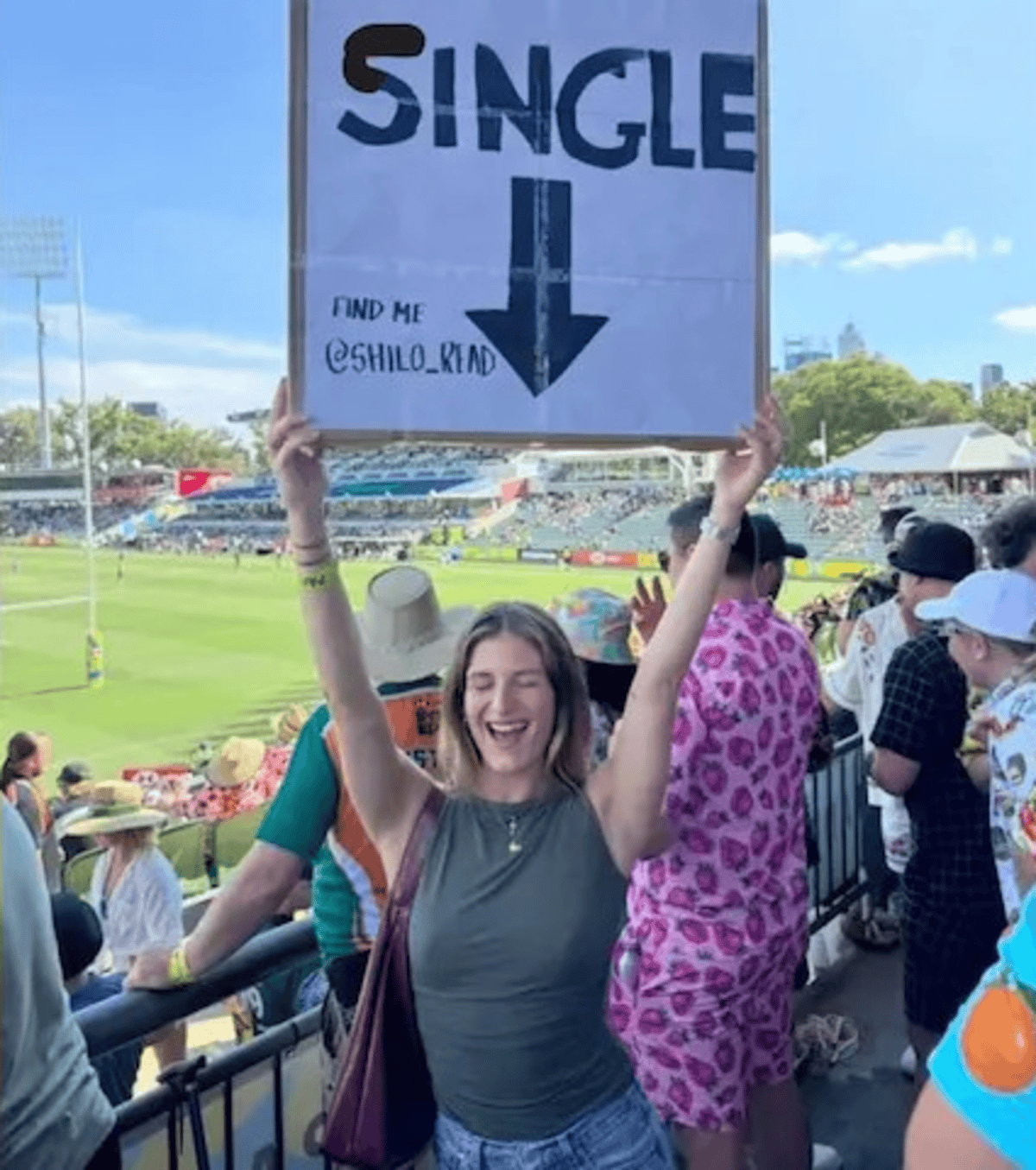 Girl with a poster looking for love