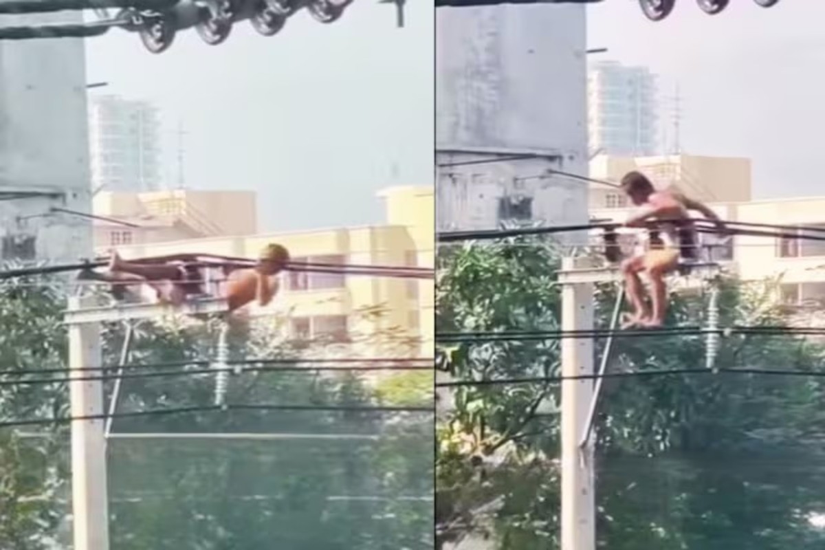 Man Hangs On Wire Does Pull Ups