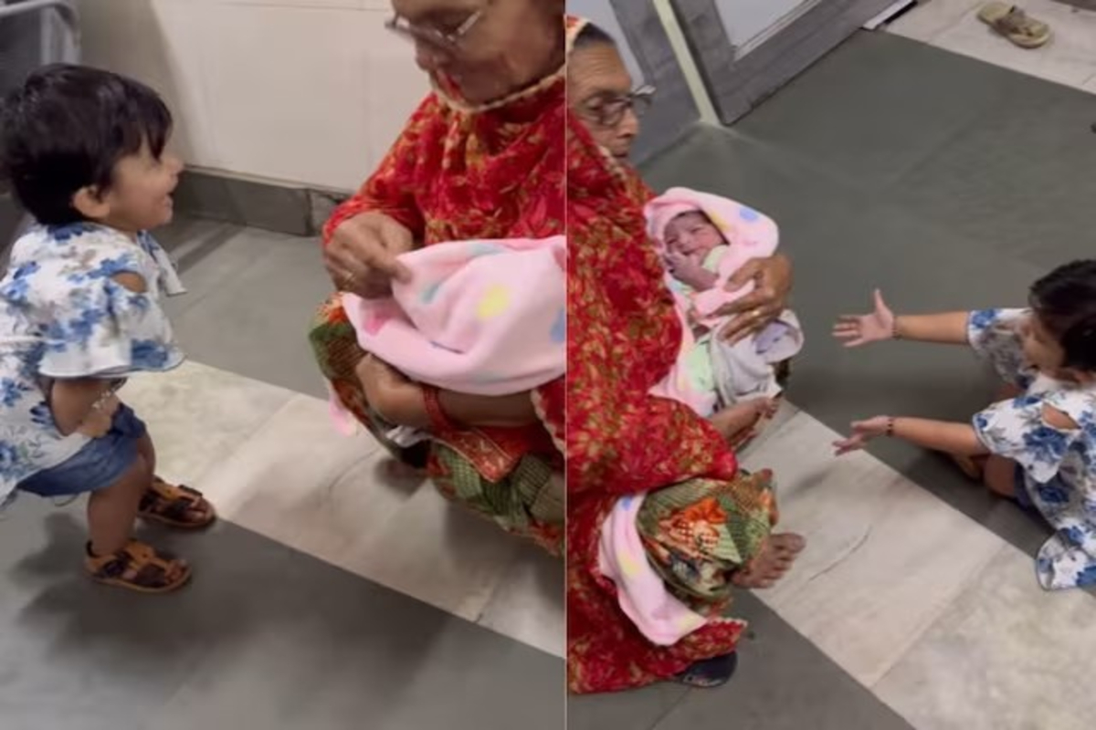 Girl meets her baby brother first time video