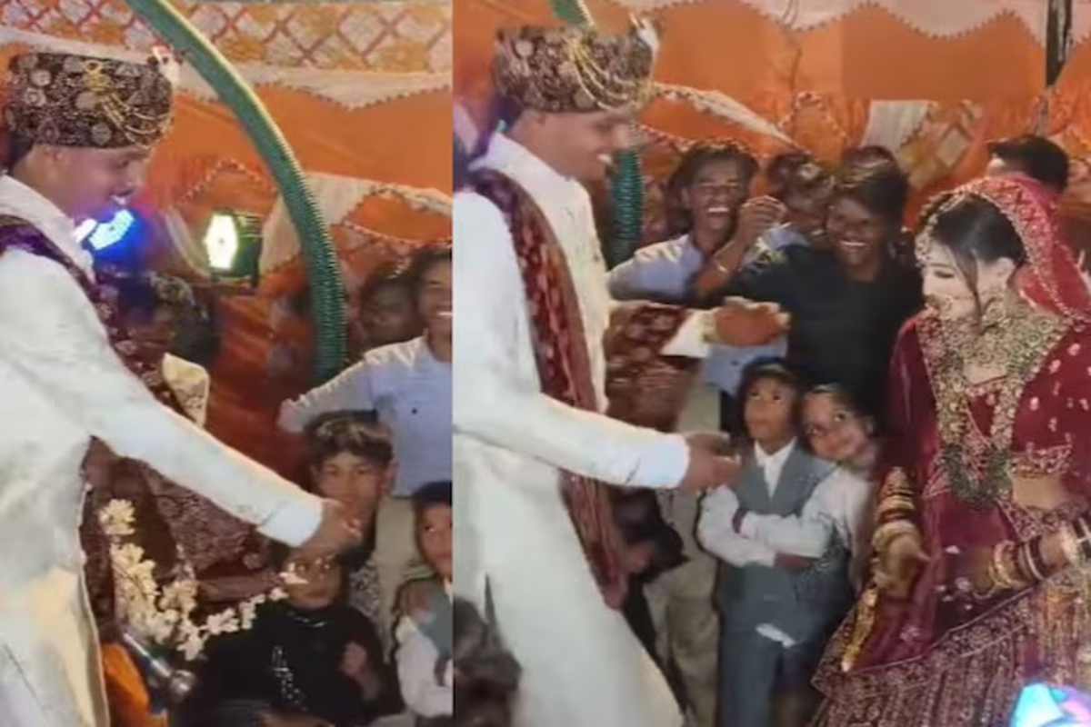 Groom lifts bride in arms video