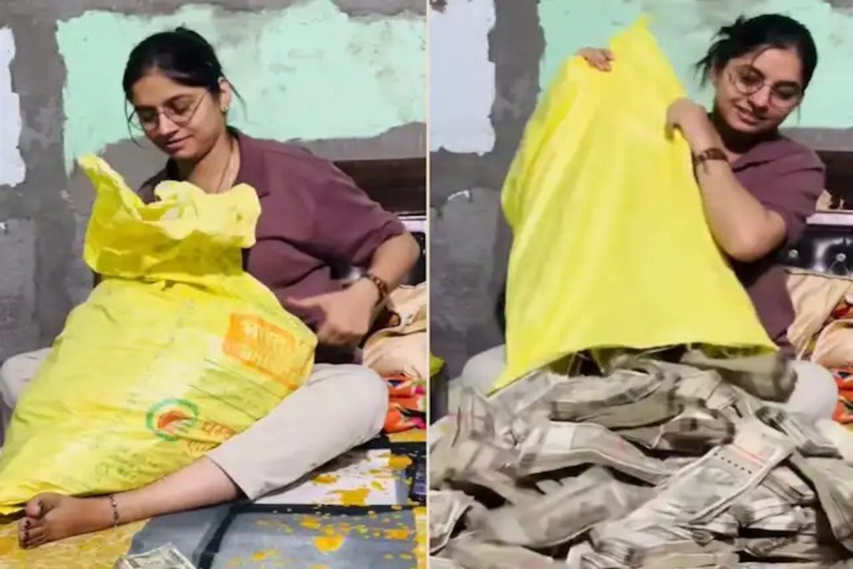 Girl Spreads Note Bundles on Bed Video