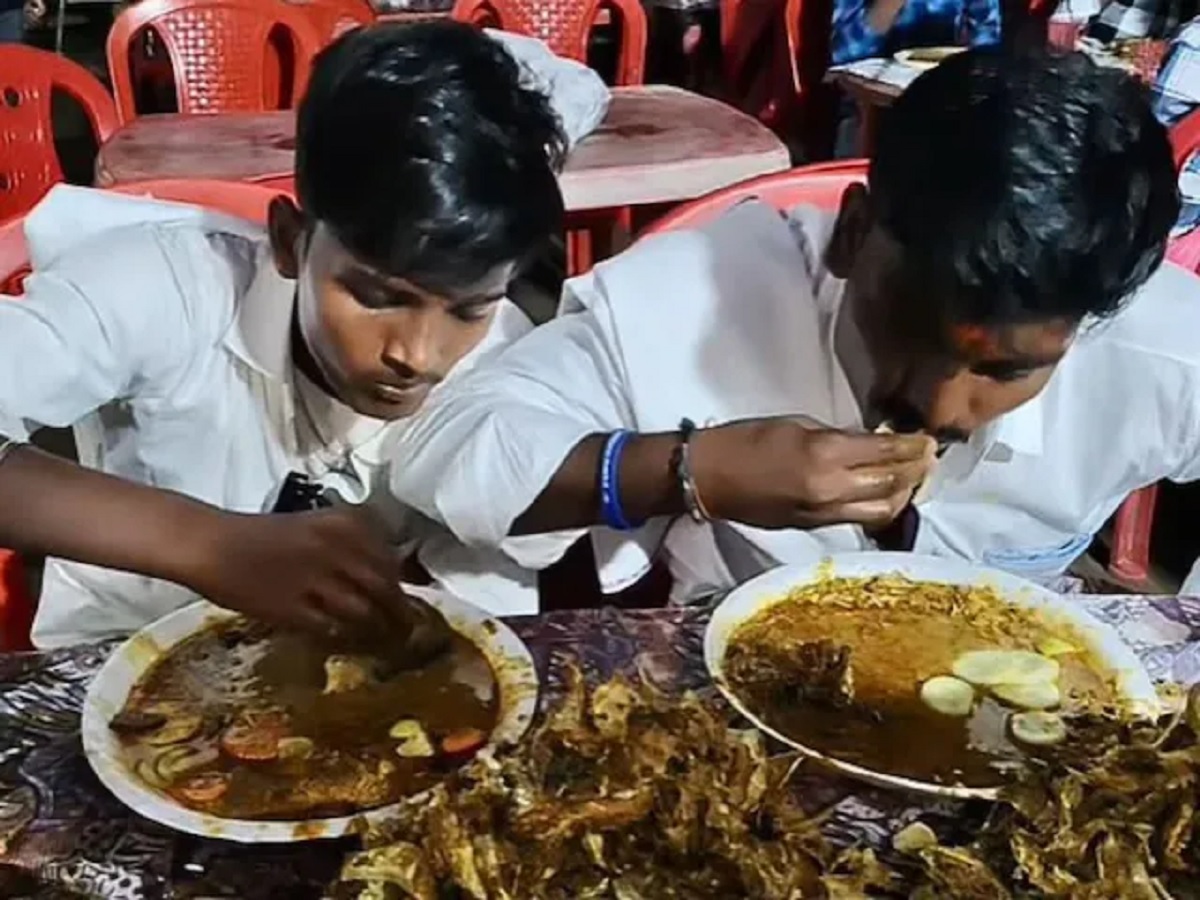 Men Eating Fish In Party
